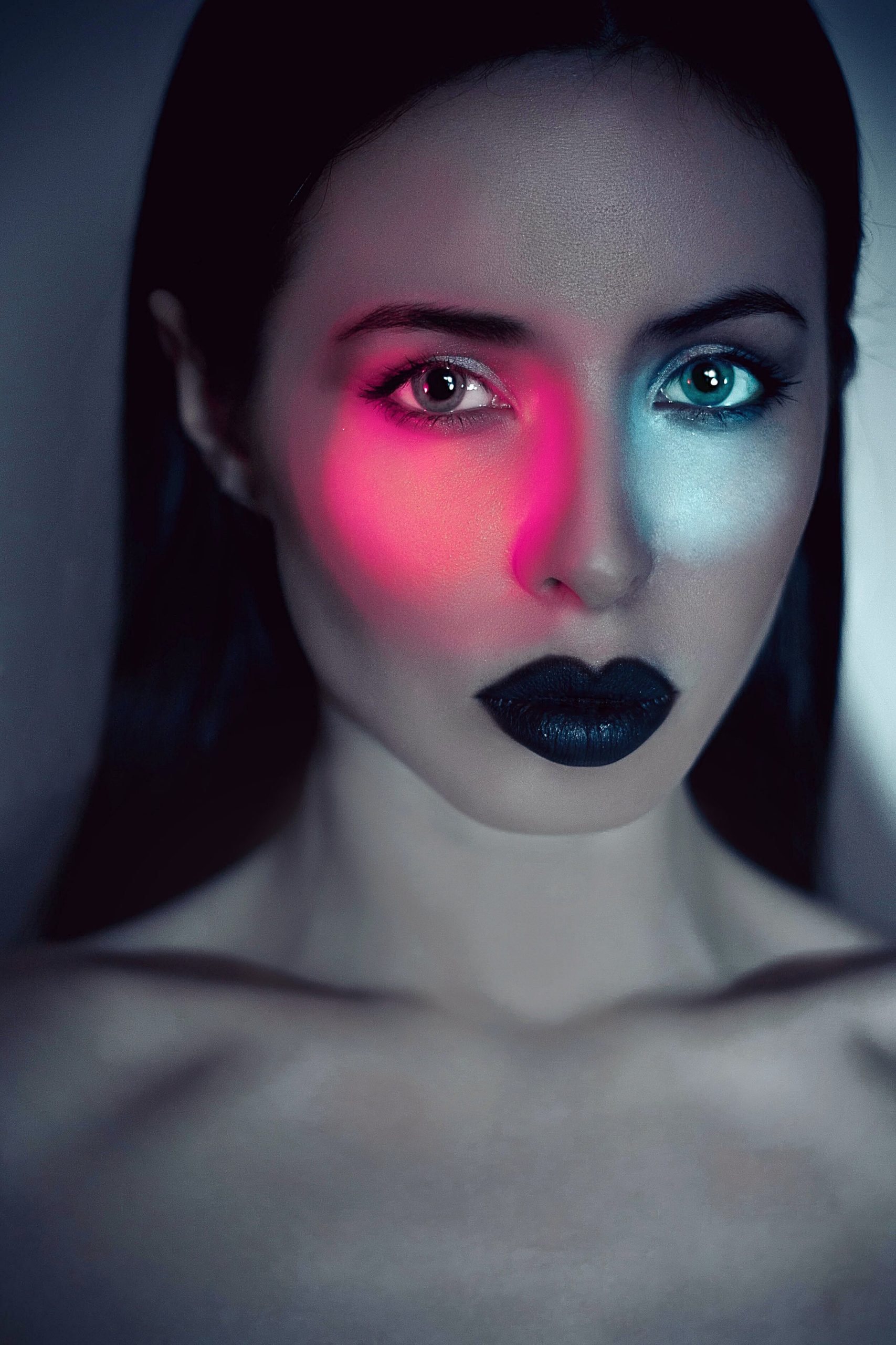 Bold doesn’t always have to be bright. It can simply mean strong contrast, like this black lipstick on her pale skin. Photo by Ksenia Polovodova on Unsplash.
